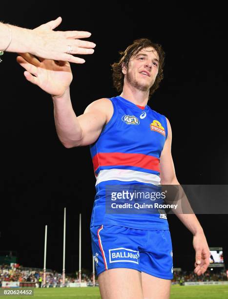 Liam Picken of the Bulldogs high fives fans after winning the round 18 AFL match between the Western Bulldogs and the Gold Coast Suns at Cazaly's...