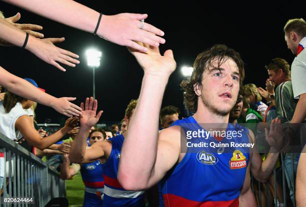 Liam Picken of the Bulldogs high fives fans after winning the round 18 AFL match between the Western Bulldogs and the Gold Coast Suns at Cazaly's...