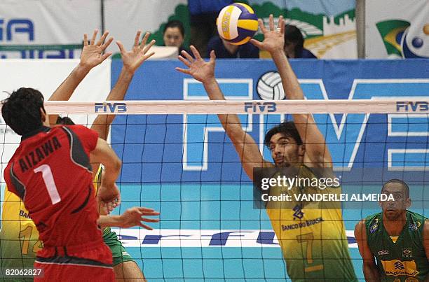 Brazil's Gilberto Gody blocks the ball from Japan's Hisashi Aizawa during their International Volleyball Federation World League match at...