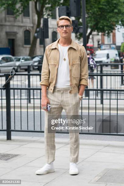 Model and Made in Chelsea star Oliver Proudlock wears River Island trousers, Zara T shirt, Converse trainers, Private White jacket and Tom Davies...