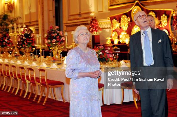 Queen Elizabeth II, accompanied by Sir Hugh Roberts, the Director of the Royal Collection, views the Summer Opening exhibition at Buckingham Palace...