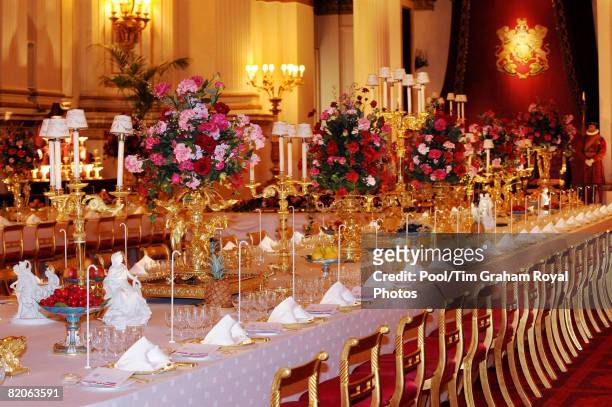 Table laid with the silver-gilt Grand Service and arranged for a State Banquet, part of the Summer Opening exhibition at Buckingham Palace, on July...