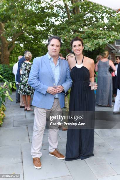 Scott Musmanno and Elizabeth Musmanno attend Hamptons Event to Celebrate FIT at The Hornig Residence on July 21, 2017 in Water Mill, New York.