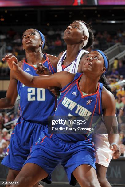 Shameka Christon and Tiffany Jackson of the New York Liberty box out Barbara Farris of the Phoenix Mercury during the WNBA game on July 5, 2008 at US...