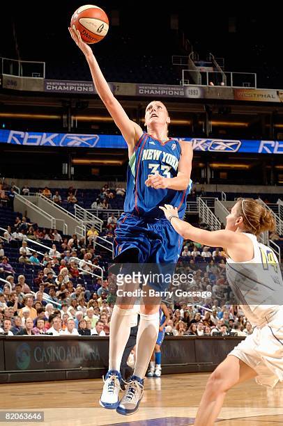 Cathrine Kraayeveld of the New York Liberty lays the ball up over Allie Quigley of the Phoenix Mercury during the WNBA game on July 5, 2008 at US...