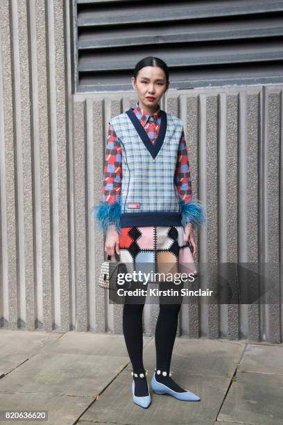 Fashion buyer Sherry Shen wears a Prada jumper and shirt on day 1 of London Collections: Men on June 9, 2017 in Paris, France.