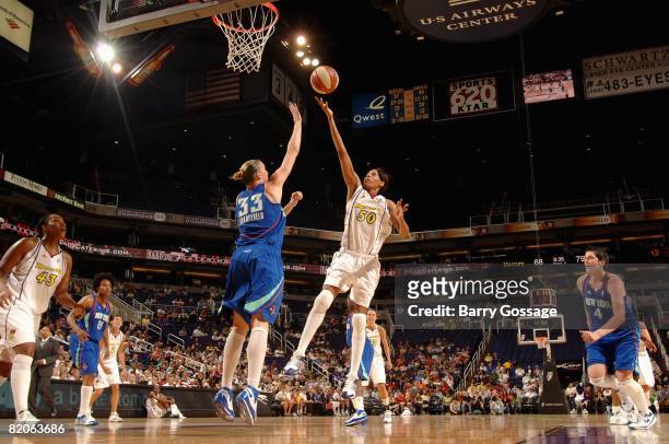 Tangela Smith of the Phoenix Mercury puts a shot up over Cathrine Kraayeveld of the New York Liberty during the WNBA game on July 5, 2008 at US...