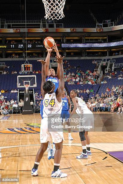 Erlana Larkins of the New York Liberty goes up for a shot over Barbara Farris of the Phoenix Mercury during the WNBA game on July 5, 2008 at US...