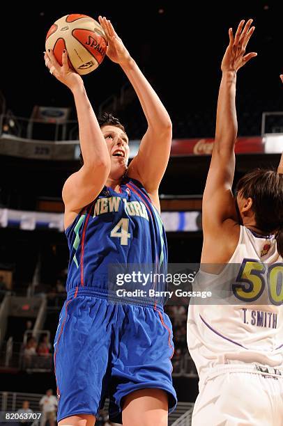 Janel McCarville of the New York Liberty goes up for a shot over Tangela Smith of the Phoenix Mercury during the WNBA game on July 5, 2008 at US...