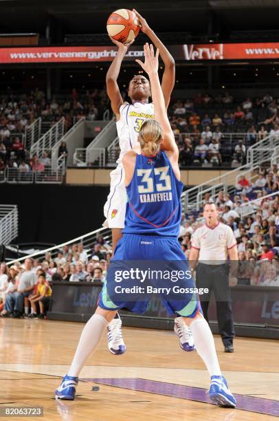 LaToya Pringle of the Phoenix Mercury shoots over Cathrine Kraayeveld of the New York Liberty during the WNBA game on July 5, 2008 at US Airways...