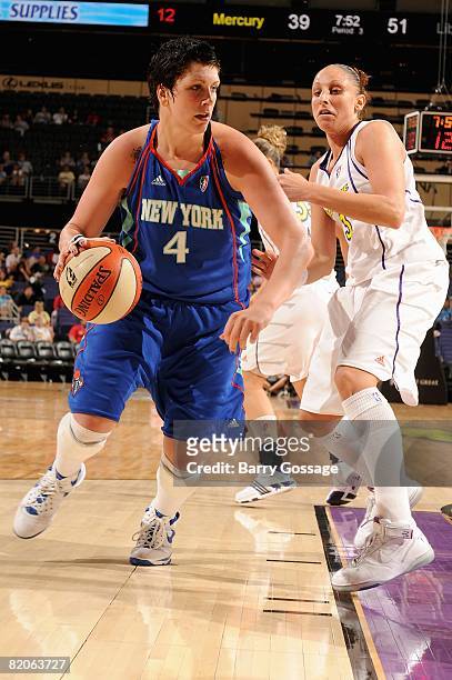 Janel McCarville of the New York Liberty drives to the basket past Diana Taurasi of the Phoenix Mercury during the WNBA game on July 5, 2008 at US...