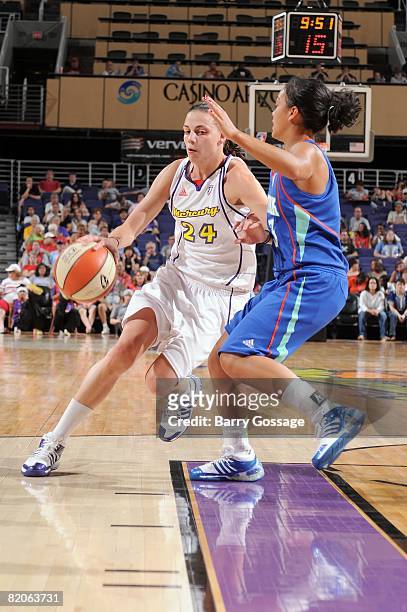Jennifer Derevjanik of the Phoenix Mercury drives to the basket past Leilani Mitchell of the New York Liberty during the WNBA game on July 5, 2008 at...