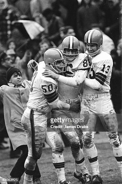 Championship: Cleveland Browns Gary Collins victorious with teammates Vince Costello and QB Frank Ryan after making touchdown catch vs Baltimore...