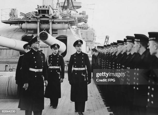Captain Otto Ciliax , Captain of the German battleship 'Scharnhorst', carries out an inspection of the crew, circa 1939.
