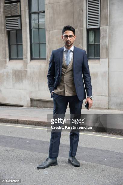 Creative director Saad Wadia wears Zara shoes and glasses and a Saran Kohli suit, waistcoat, shirt and tie on day 1 of London Collections: Men on...