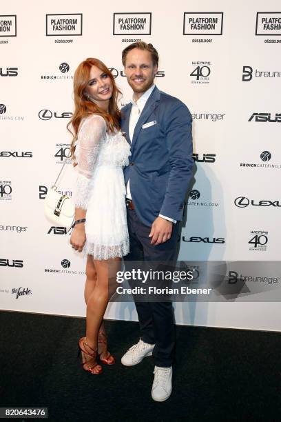 Irina Schmidt and Thomas Hoehn attend the Breuninger show during Platform Fashion July 2017 at Areal Boehler on July 21, 2017 in Duesseldorf, Germany.