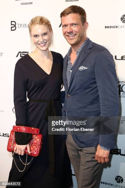 Kim Hnizdo and Christian Witt attend the Breuninger show during Platform Fashion July 2017 at Areal Boehler on July 21, 2017 in Duesseldorf, Germany.