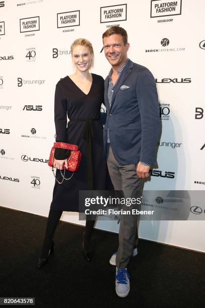 Kim Hnizdo and Christian Witt attend the Breuninger show during Platform Fashion July 2017 at Areal Boehler on July 21, 2017 in Duesseldorf, Germany.