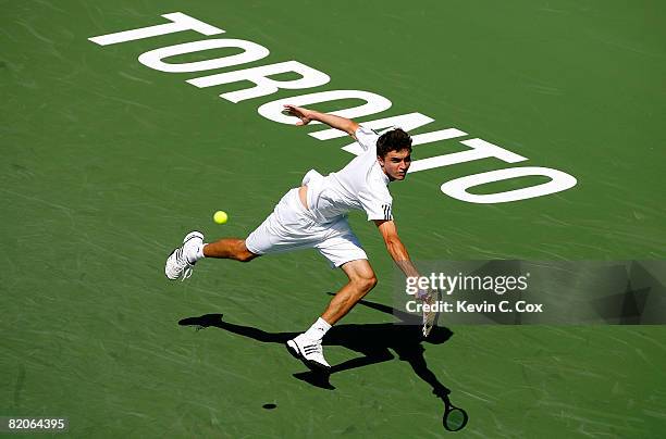 Gilles Simon of France returns a shot to Marin Cilic of Croatia during the Rogers Cup at the Rexall Centre at York University on July 25, 2008 in...