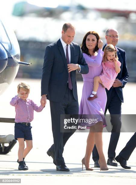 Prince George of Cambridge, Prince William, Duke of Cambridge, Catherine, Duchess of Cambridge and Princess Charlotte of Cambridge depart from...