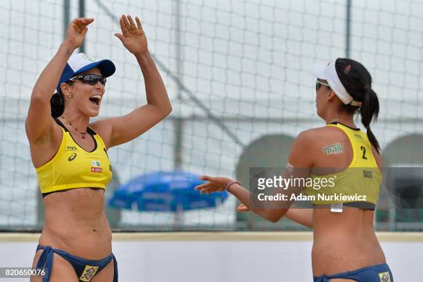 Brazil's Agatha Bednarczuk puts hands up to celebrate with Duda Lisboa during FIVB Grand Tour - Olsztyn: Day 4 on July 22, 2017 in Olsztyn, Poland.
