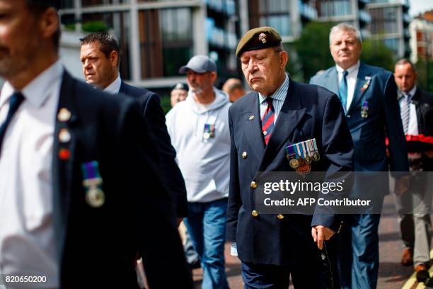 Supporters and former soldiers march from Hyde Park Barracks to demand justice for those who died in a 1982 IRA bomb attack in London on July 22,...