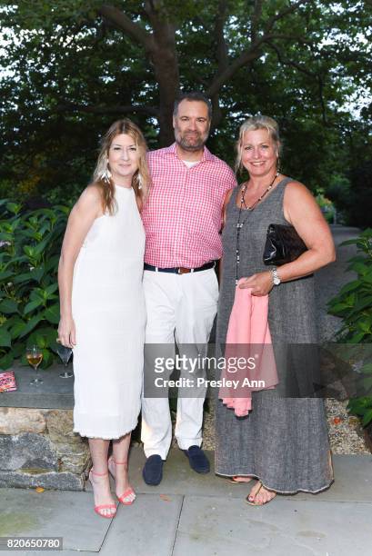 Kathy Riley, Kevin Scere and Emme attend Hamptons Event to Celebrate FIT at The Hornig Residence on July 21, 2017 in Water Mill, New York.