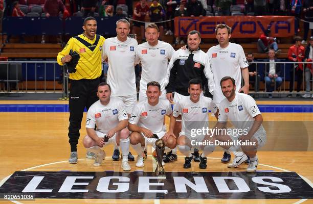 The Liverpool Legend's players pose for a photo after defeating the Socceroos Legends in the final during the match between the Liverpool Legends and...