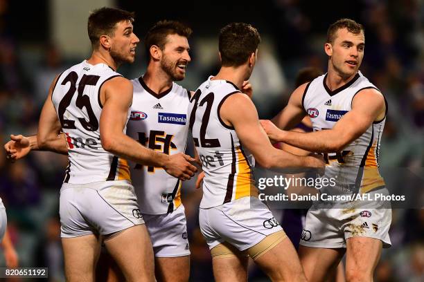 Brendan Whitecross and Ryan Schoenmakers of the Hawks celebrates a goal during the 2017 AFL round 18 match between the Fremantle Dockers and the...