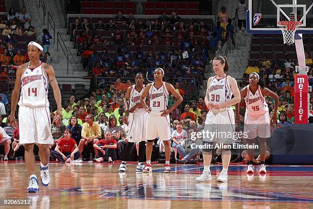 Deanna Nolan, Sheri Sam, Plenette Pierson, Katie Smith and Kara Braxton of the Detroit Shock stand on the court during the WNBA game against the...
