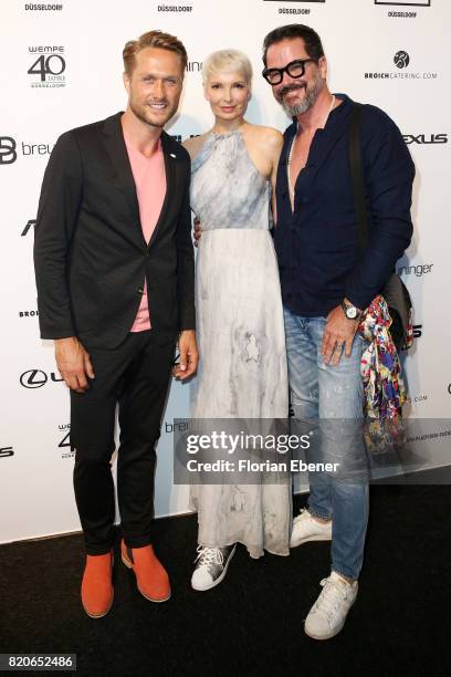 Nico Schwanz and Britt and Alex Jolig attend the Breuninger show during Platform Fashion July 2017 at Areal Boehler on July 21, 2017 in Duesseldorf,...