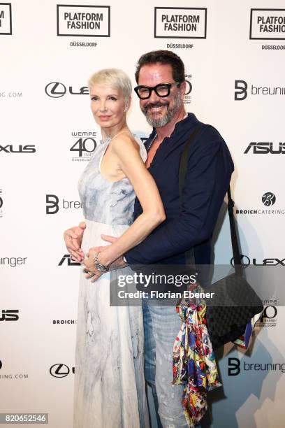 Britt and Alex Jolig attend the Breuninger show during Platform Fashion July 2017 at Areal Boehler on July 21, 2017 in Duesseldorf, Germany.