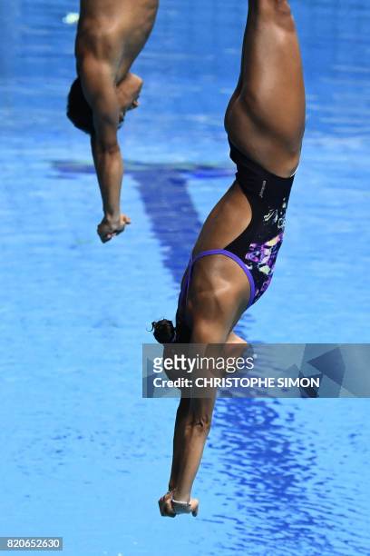 Colombia's Diana Isabel Pineda Zuleta and Colombia's Sebastian Villa Castaneda compete in the Mixed 3m synchro springboard final during the diving...