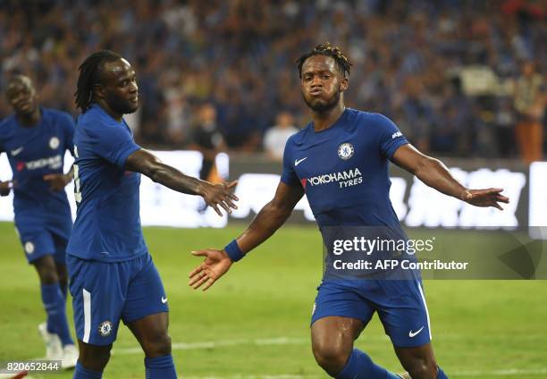 Chelsea's Michy Batshuayi celebrates after scoring against Arsenal during their pre-season friendly football match at Beijing's National Stadium,...