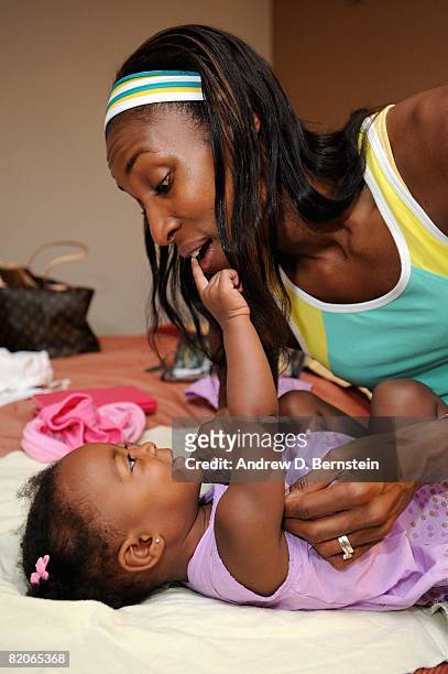Lisa Leslie of the Los Angeles Sparks plays with daughter Lauren Lockwood on July 14, 2008 in Los Angeles, California. NOTE TO USER: User expressly...