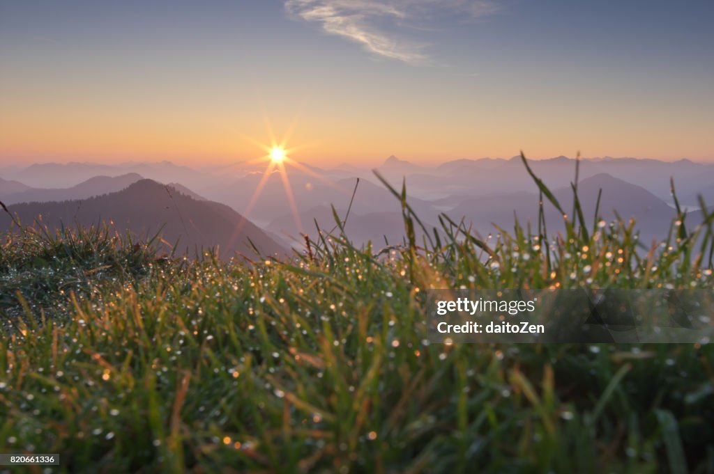 Low angle view of sunrise over Austrian Alps and Bavarian Alps, seen from Mt. Jochberg, Bavaria, Germany