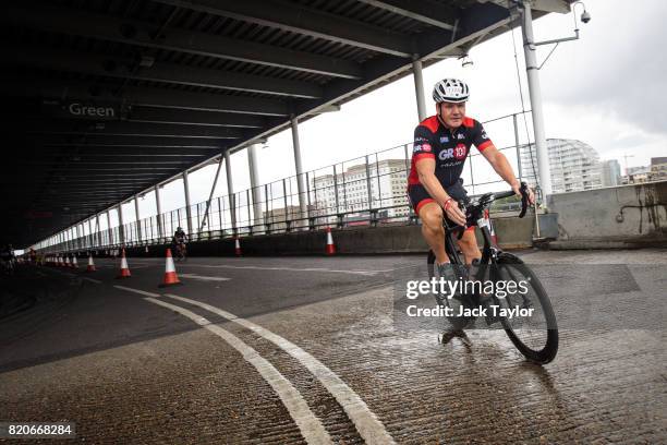 Television personality and chef Gordon Ramsay takes part in the cycle stage during the AJ Bell London Triathlon 2017 at Royal Victoria Docks on July...