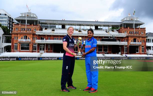 Heather Knight, Captain of England and Mithali Raj, Captain of India pose with the Women's World Cup Trophy during the England v India: Final - ICC...