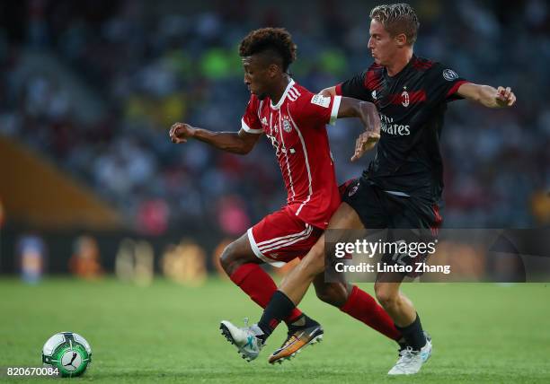 Kingsley Coman of FC Bayern competes for the ball with Andrea Conti of AC Milan during the 2017 International Champions Cup China match between FC...