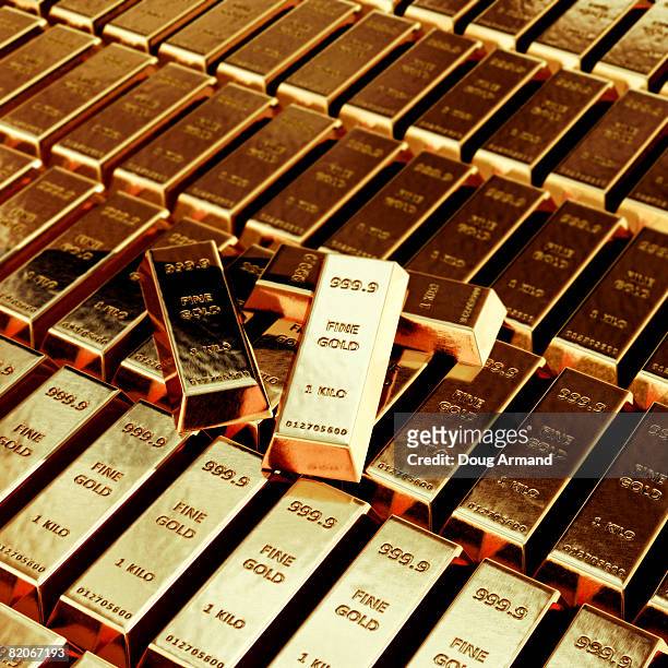 stacks of gold bars - gold bullion stock pictures, royalty-free photos & images