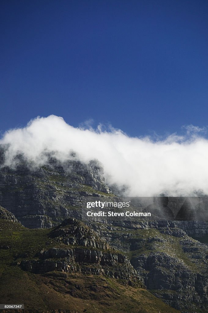 Clouds rolling over the edge of Table Mountain