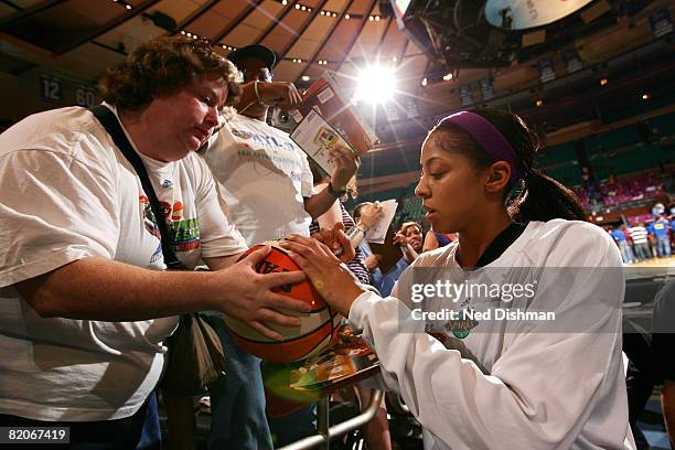 Candace Parker of the Los Angeles Sparks signs autographs before game against the New York Liberty on July 25, 2008 at Madison Square Garden in New...