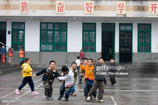 Children playing in the playground of a primary school in Fuli, China has a one child policy to limit population,