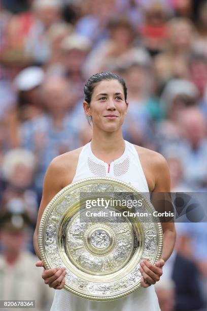 Garbine Muguruza of Spain with the winners trophy after victory in the Ladies Singles final defeating Venus Williams of The United States during the...