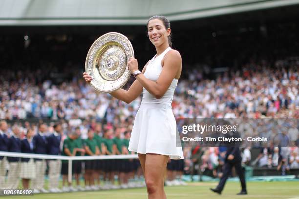 Garbine Muguruza of Spain with the winners trophy after victory in the Ladies Singles final defeating Venus Williams of The United States during the...
