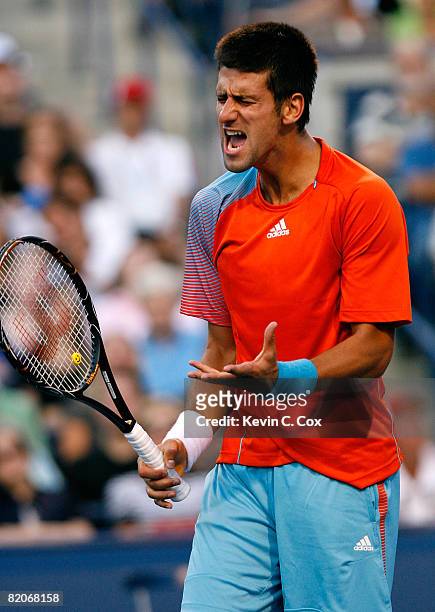Novak Djokovic of Serbia reacts after losing a point to Andy Murray of Scotland during the Rogers Cup at the Rexall Centre at York University on July...
