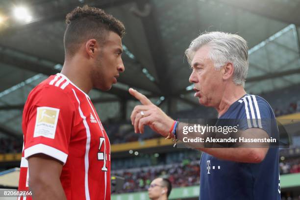 Carlo Ancelotti, head coach of FC Bayern Muenchen talks to his palyer Corentin Tolisso during the International Champions Cup Shenzen 2017 match...