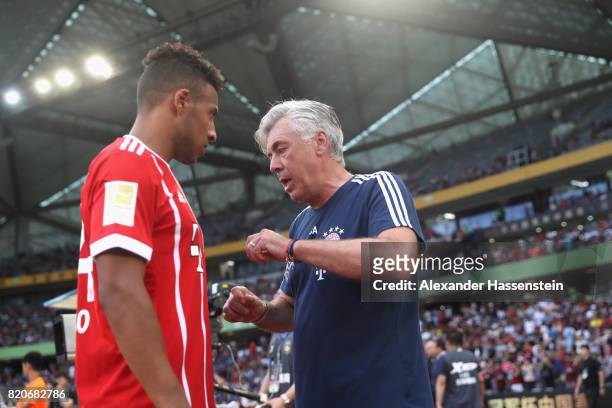 Carlo Ancelotti, head coach of FC Bayern Muenchen talks to his palyer Corentin Tolisso during the International Champions Cup Shenzen 2017 match...