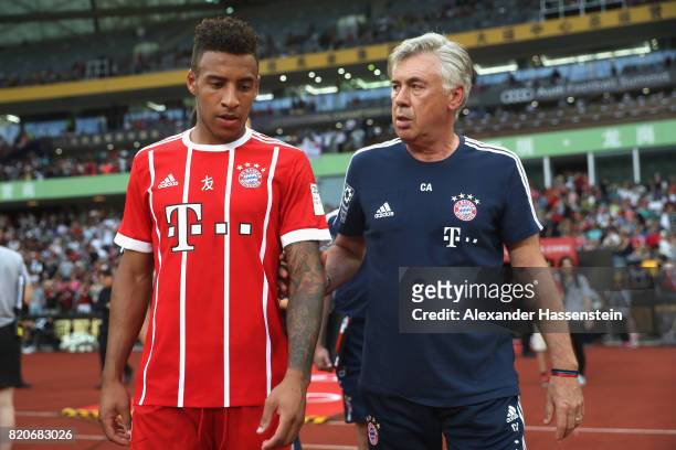 Carlo Ancelotti, head coach of FC Bayern Muenchen talks to his palyer Corentin Tolisso during the International Champions Cup Shenzen 2017 match...