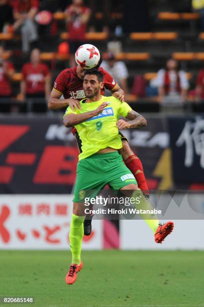 Joaquin Larrivey of JEF United Chiba and Koji Noda of Zweigen Kanagawa compete for the ball during the J.League J2 match between JEF United Chiba and...